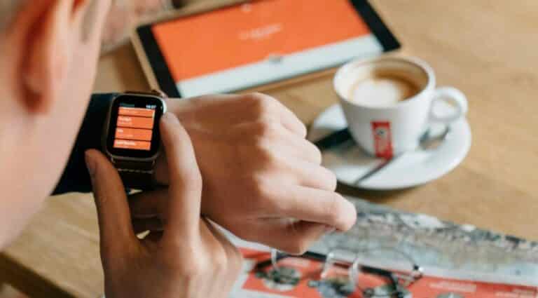 A person looking at appointments on a smart watch.