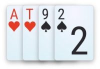 A double-suited disconnected starting hand in 4-card PLO - A♥T♥9♠2♠.